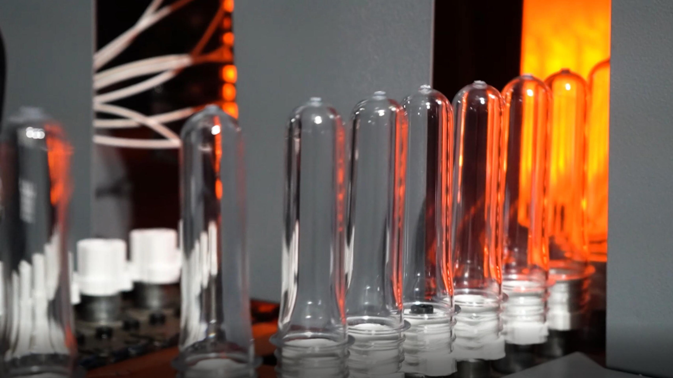 why a water bottling company choose to produce its own plastic water bottles: 2 bottle preform heater oven scaled